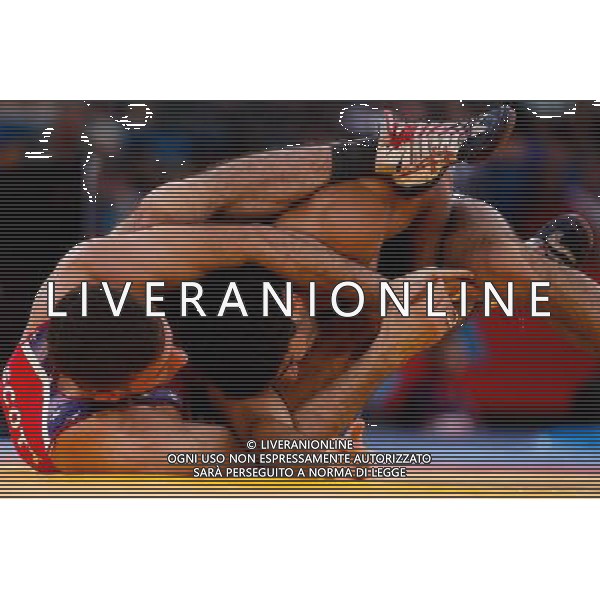 (120811) -- LONDON, Aug. 11, 2012 () -- Toghrul Asgarov of Azerbaijan (blue) competes with Coleman Scott of the United States during the Men\'s 60kg Freestyle of Wrestling at London 2012 Olympic Games, London, Britain, Aug. 11, 2012. Toghrul Asgarov of Azerbaijan won the match and advanced to final. (/Jin Liwang) ©PHOTOSHOT/Agenzia Aldo Liverani Sas - ITALY ONLY - GIOCHI OLIMPICI, OLIMPIADI LONDRA 2012