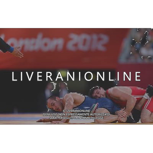 (120811) -- LONDON, Aug. 11, 2012 () -- Sharif Sharifov of Azerbaijan (in red) competes with Ehsan Naser Lashgari of Iran during men\'s wrestling freestyle 84kg semifinal match, at London 2012 Olympic Games in London, Britain, on August 11, 2012. Sharif Sharifov of Azerbaijan won. (/Jin Liwang) (nxl) ©PHOTOSHOT/Agenzia Aldo Liverani Sas - ITALY ONLY - GIOCHI OLIMPICI, OLIMPIADI LONDRA 2012