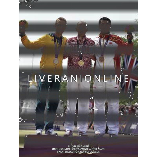 (120811) -- LONDON, Aug. 11, 2012 () -- Gold medalist Sergey Kirdyapkin of Russia (C), silver medalist Jared Tallent of Australia (L) and bronze medalist Si Tianfeng of China attend victory ceremony of men\'s 50km race walk contest, at London 2012 Olympic Games in London, Britain, on August 11, 2012. (/Gesang Dawa) (nxl) ©PHOTOSHOT/Agenzia Aldo Liverani Sas - ITALY ONLY - GIOCHI OLIMPICI, OLIMPIADI LONDRA 2012