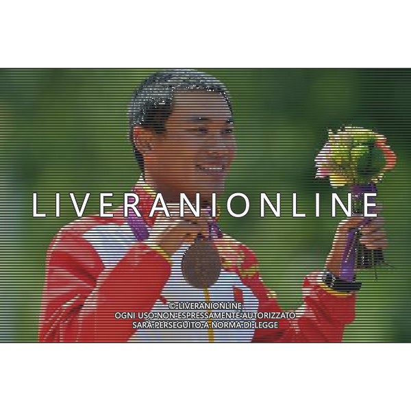(120811) -- LONDON, Aug. 11, 2012 () -- Si Tianfeng of China celebrates during victory ceremony of men\'s 50km race walk contest, at London 2012 Olympic Games in London, Britain, on August 11, 2012. Si Tianfeng of China won bronze medal. (/Gesang Dawa) (nxl) ©PHOTOSHOT/Agenzia Aldo Liverani Sas - ITALY ONLY - GIOCHI OLIMPICI, OLIMPIADI LONDRA 2012