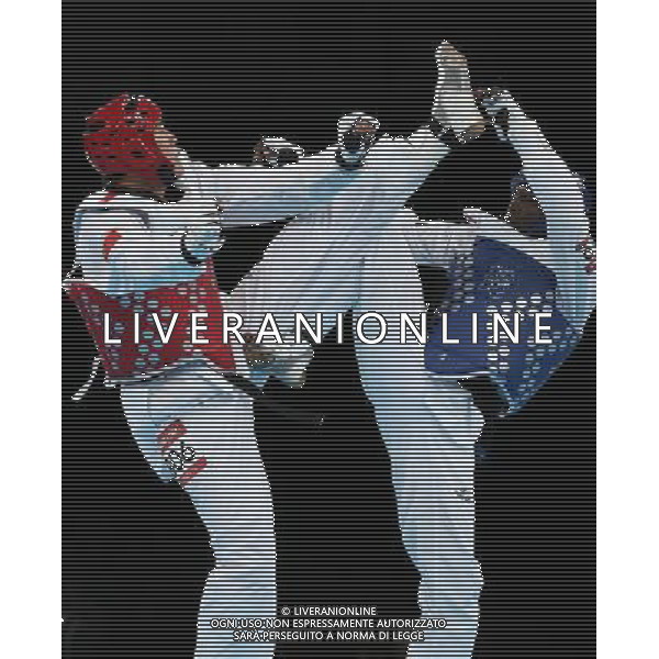 (120811) -- LONDON, Aug. 11, 2012 () -- Liu Xiaobo of China (red) competes with Kenneth Edwards of Jamaica during men\'s Taekwondo +80kg preliminary round match, at London 2012 Olympic Games in London, Britain, on August 11, 2012. Liu Xiaobo of China won. (/Wang Lili) (nxl) ©PHOTOSHOT/Agenzia Aldo Liverani Sas - ITALY ONLY - GIOCHI OLIMPICI, OLIMPIADI LONDRA 2012