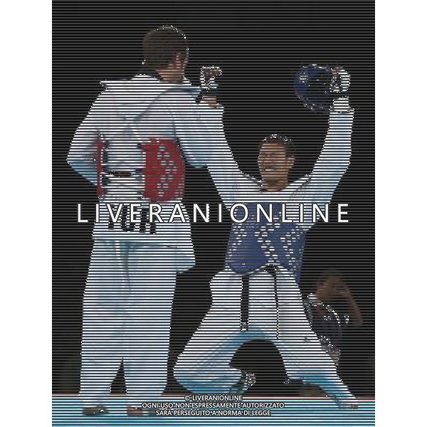 (120811) -- LONDON, Aug. 11, 2012 () -- Liu Xiaobo of China (blue) celebrates after winning over Bahri Tanrikulu of Turkey during the bronze medal match of men\'s +80kg Taekwondo at London 2012 Olympic Games, London, Britain, Aug. 11, 2012. Liu Xiaobo of China won the match and claimed the bronze medal of the event. (/Wang Lili) ©PHOTOSHOT/Agenzia Aldo Liverani Sas - ITALY ONLY - GIOCHI OLIMPICI, OLIMPIADI LONDRA 2012