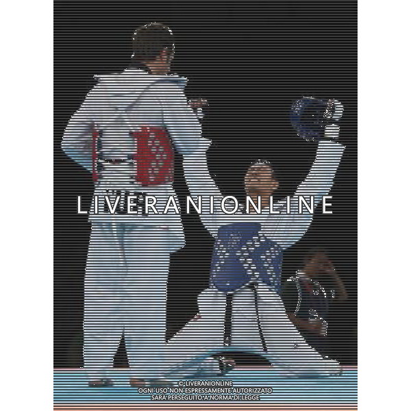 (120811) -- LONDON, Aug. 11, 2012 () -- Liu Xiaobo of China (blue) celebrates after winning over Bahri Tanrikulu of Turkey during the bronze medal match of men\'s +80kg Taekwondo at London 2012 Olympic Games, London, Britain, Aug. 11, 2012. Liu Xiaobo of China won the match and claimed the bronze medal of the event. (/Wang Lili) ©PHOTOSHOT/Agenzia Aldo Liverani Sas - ITALY ONLY - GIOCHI OLIMPICI, OLIMPIADI LONDRA 2012