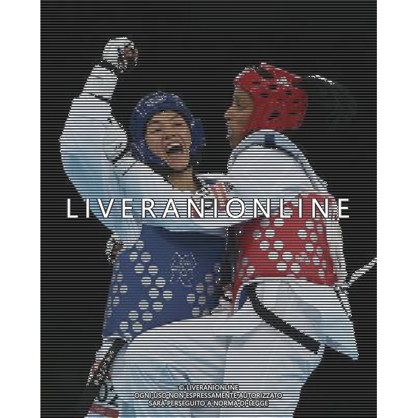 (120811) -- LONDON, Aug. 11, 2012 () -- Maria del Rosario of Mexico (blue) competes with Glenhis Hernandez of Cuba during the bronze medal match of women\'s +67kg Taekwondo at London 2012 Olympic Games, London, Britain, Aug. 11, 2012. Maria del Rosario of Mexico won the match and claimed the bronze medal of the event. (/Wang Lili) ©PHOTOSHOT/Agenzia Aldo Liverani Sas - ITALY ONLY - GIOCHI OLIMPICI, OLIMPIADI LONDRA 2012