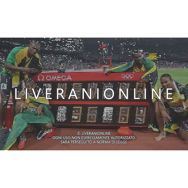 (120811) -- LONDON, Aug. 1, 2012 () -- Usain Bolt, Yohan Blake, Nesta Carter, and Michael Frater (from L to R) of Jamaica celebrate after men\'s 4x100m relay final at London 2012 Olympic Games, London, Britain, Aug. 11, 2012. The Jamaican team won gold medal with a new world record of 36.84. (/Liao Yujie)(zgp) ©PHOTOSHOT/Agenzia Aldo Liverani Sas - ITALY ONLY - GIOCHI OLIMPICI, OLIMPIADI LONDRA 2012