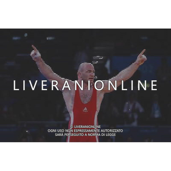 (120811) -- LONDON, Aug. 11, 2012 () -- Artur Taymazov of Uzbekistan (in red) celebrates after defeating Davit Modzmanashvili of Georgia in men\'s wrestling freestyle 120kg gold medal contest, at London 2012 Olympic Games in London, Britain, on August 11, 2012. Artur Taymazov of Uzbekistan won gold medal. (/Jin Liwang) (nxl) ©PHOTOSHOT/Agenzia Aldo Liverani Sas - ITALY ONLY - GIOCHI OLIMPICI, OLIMPIADI LONDRA 2012