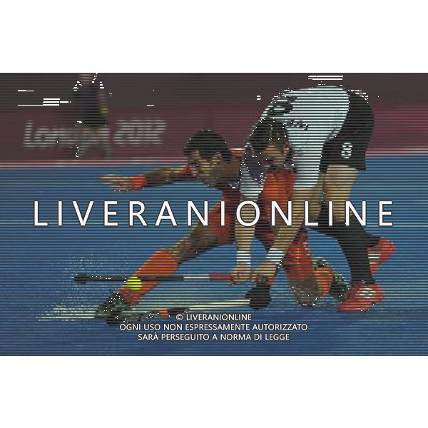 (120811) -- LONDON, Aug. 11, 2012 () -- Christopher Wesley of Germany (R) vies for the ball during the gold medal match of men\'s Hockey between the Netherlands and Germany at London 2012 Olympic Games, London, Britain, Aug. 11, 2012. (/Wang Yuguo) ©PHOTOSHOT/Agenzia Aldo Liverani Sas - ITALY ONLY - GIOCHI OLIMPICI, OLIMPIADI LONDRA 2012