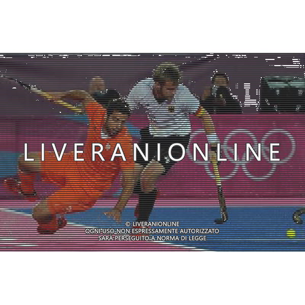 (120811) -- LONDON, Aug. 11, 2012 () -- Maximilian Mueller of Germany (R) vies for the ball during the gold medal match of men\'s Hockey between the Netherlands and Germany at London 2012 Olympic Games, London, Britain, Aug. 11, 2012. (/Wang Yuguo) ©PHOTOSHOT/Agenzia Aldo Liverani Sas - ITALY ONLY - GIOCHI OLIMPICI, OLIMPIADI LONDRA 2012