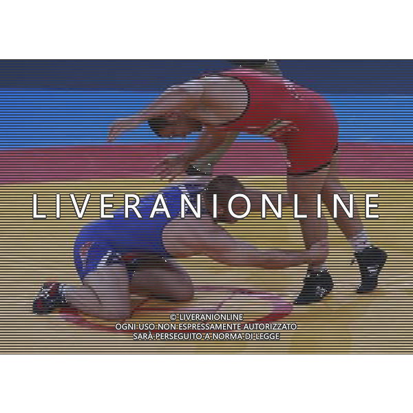 (120811) -- LONDON, Aug. 11, 2012 () -- Komeil Ghasemi of Iran (red) competes with Tervel Ivaylov Dlagnev of the United States during the Men\'s 120kg Freestyle bronze medal match of Wrestling at London 2012 Olympic Games, London, Britain, Aug. 11, 2012. Komeil Ghasemi of Iran won the match and claimed the bronze medal of the event. (/Ren Zhenglai) ©PHOTOSHOT/Agenzia Aldo Liverani Sas - ITALY ONLY - GIOCHI OLIMPICI, OLIMPIADI LONDRA 2012