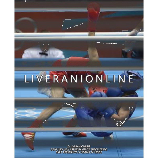 (120811) -- LONDON, Aug. 11, 2012 () -- Zhou Shiming of China (in red) competes with Kaeo Pongprayoon of Thailand during men\'s boxing light fly (49kg) gold medal match, at London 2012 Olympic Games in London, Britain, on August 11, 2012. Zhou Shiming of China defeated Kaeo Pongprayoon of Thailand. (/Li Ga) (nxl) ©PHOTOSHOT/Agenzia Aldo Liverani Sas - ITALY ONLY - GIOCHI OLIMPICI, OLIMPIADI LONDRA 2012