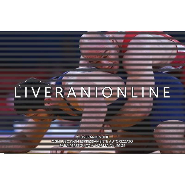 (120811) -- LONDON, Aug. 11, 2012 () -- Artur Taymazov of Uzbekistan (red) competes with Davit Modzmanashvili of Georgia during the Men\'s 120kg Freestyle gold medal match of Wrestling at London 2012 Olympic Games, London, Britain, Aug. 11, 2012. Artur Taymazov of Uzbekistan won the match and claimed the gold medal of the event. (/Jin Liwang) ©PHOTOSHOT/Agenzia Aldo Liverani Sas - ITALY ONLY - GIOCHI OLIMPICI, OLIMPIADI LONDRA 2012