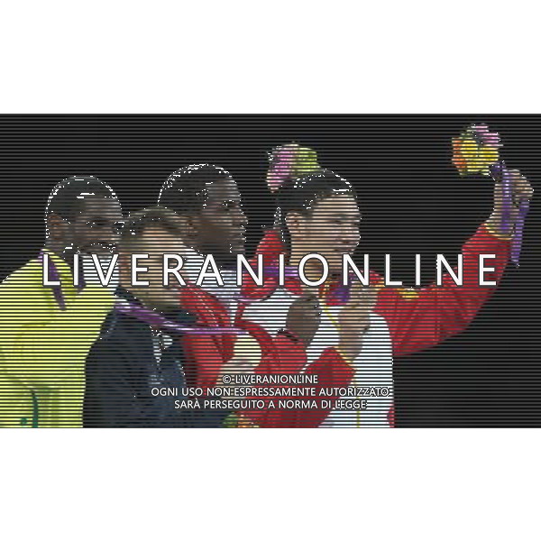(120811) -- LONDON, Aug. 11, 2012 () -- Gold medalist Carlo Molfetta of Italy (2nd L), silver medalist Anthony Obame of Gabon (1st L), bronze medalists Robelis Despaigne of Cuba (2nd R) and Liu Xiaobo of China pose at the awarding ceremony of men\'s +80kg Taekwondo at London 2012 Olympic Games, London, Britain, Aug. 11, 2012. (/Wang Lili) ©PHOTOSHOT/Agenzia Aldo Liverani Sas - ITALY ONLY - GIOCHI OLIMPICI, OLIMPIADI LONDRA 2012