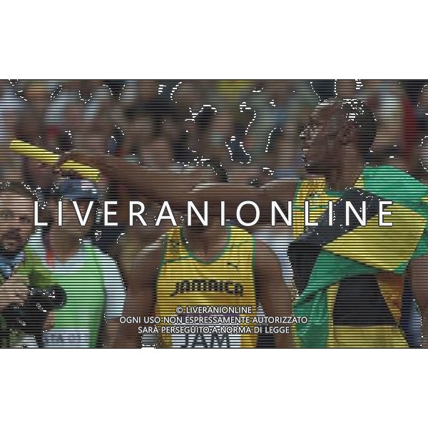 (120811) -- LONDON, Aug. 1, 2012 () -- Usain Bolt (R) of Jamaica celebrates after men\'s 4x100m relay final at London 2012 Olympic Games, London, Britain, Aug. 11, 2012. The Jamaican team won gold medal with a new world record of 36.84. (/Liao Yujie)(zgp) ©PHOTOSHOT/Agenzia Aldo Liverani Sas - ITALY ONLY - GIOCHI OLIMPICI, OLIMPIADI LONDRA 2012