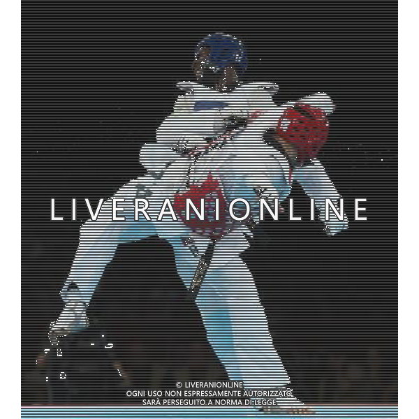 (120811) -- LONDON, Aug. 11, 2012 () -- Carlo Molfetta of Italy (red) competes with Anthony Obame of Gabon during Bahri Tanrikulu of Turkey during the gold medal match of men\'s +80kg Taekwondo at London 2012 Olympic Games, London, Britain, Aug. 11, 2012. Carlo Molfetta of Italy won the match and claimed the gold medal of the event. (/Wang Lili) ©PHOTOSHOT/Agenzia Aldo Liverani Sas - ITALY ONLY - GIOCHI OLIMPICI, OLIMPIADI LONDRA 2012