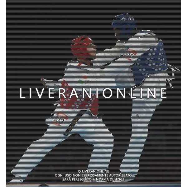 (120811) -- LONDON, Aug. 11, 2012 () -- Carlo Molfetta of Italy (red) competes with Anthony Obame of Gabon during Bahri Tanrikulu of Turkey during the gold medal match of men\'s +80kg Taekwondo at London 2012 Olympic Games, London, Britain, Aug. 11, 2012. Carlo Molfetta of Italy won the match and claimed the gold medal of the event. (/Li Ga) ©PHOTOSHOT/Agenzia Aldo Liverani Sas - ITALY ONLY - GIOCHI OLIMPICI, OLIMPIADI LONDRA 2012