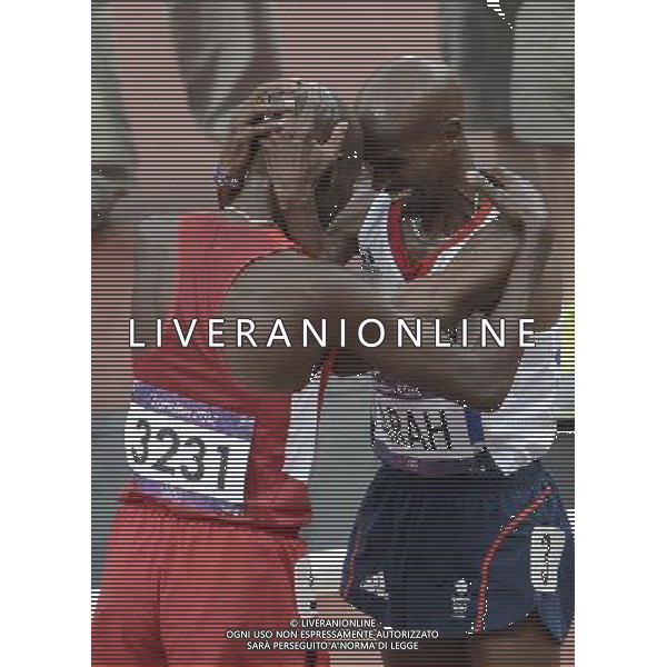 (120811) -- LONDON, Aug. 11, 2012 () -- Mohamed Farah (R) of Britain celebrates after men\'s 5000m final at London 2012 Olympic Games, London, Britain, Aug. 11, 2012. Mohamed Farah won gold medal with 13:41.66. (/Liao Yujie)(zgp) ©PHOTOSHOT/Agenzia Aldo Liverani Sas - ITALY ONLY - GIOCHI OLIMPICI, OLIMPIADI LONDRA 2012
