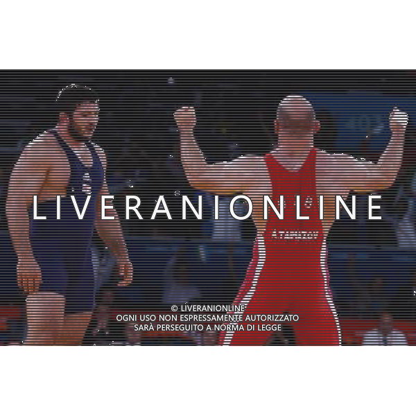 (120811) -- LONDON, Aug. 11, 2012 () -- Artur Taymazov of Uzbekistan (red) celebrates after winning over Davit Modzmanashvili of Georgia during the Men\'s 120kg Freestyle gold medal match of Wrestling at London 2012 Olympic Games, London, Britain, Aug. 11, 2012. Artur Taymazov of Uzbekistan won the match and claimed the gold medal of the event. (/Jin Liwang) ©PHOTOSHOT/Agenzia Aldo Liverani Sas - ITALY ONLY - GIOCHI OLIMPICI, OLIMPIADI LONDRA 2012
