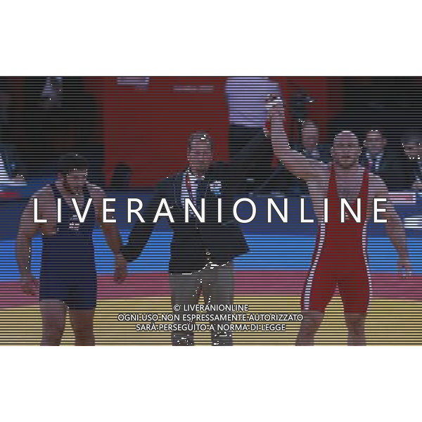 (120811) -- LONDON, Aug. 11, 2012 () -- Artur Taymazov of Uzbekistan (in red) defeats Davit Modzmanashvili of Georgia in men\'s wrestling freestyle 120kg gold medal contest, at London 2012 Olympic Games in London, Britain, on August 11, 2012. Artur Taymazov of Uzbekistan won gold medal. (/Ren Zhenglai) (nxl) ©PHOTOSHOT/Agenzia Aldo Liverani Sas - ITALY ONLY - GIOCHI OLIMPICI, OLIMPIADI LONDRA 2012