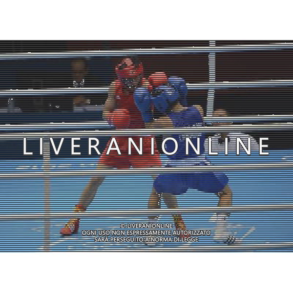 (120811) -- LONDON, Aug. 11, 2012 () -- Zhou Shiming of China (in red) competes with Kaeo Pongprayoon of Thailand during men\'s boxing light fly (49kg) gold medal match, at London 2012 Olympic Games in London, Britain, on August 11, 2012. Zhou Shiming of China defeated Kaeo Pongprayoon of Thailand. (/Guo Yong) (nxl) ©PHOTOSHOT/Agenzia Aldo Liverani Sas - ITALY ONLY - GIOCHI OLIMPICI, OLIMPIADI LONDRA 2012