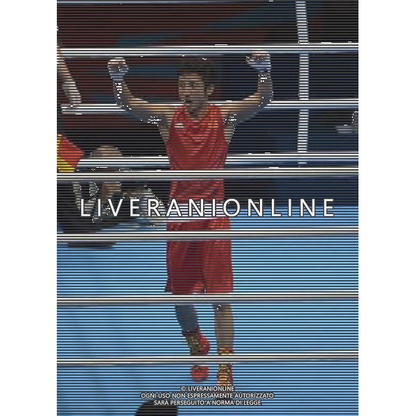 (120811) -- LONDON, Aug. 11, 2012 () -- Zhou Shiming of China celebrates after competing in men\'s boxing light fly (49kg) gold medal match, at London 2012 Olympic Games in London, Britain, on August 11, 2012. Zhou Shiming of China defeated Kaeo Pongprayoon of Thailand. (/Guo Yong) (nxl) ©PHOTOSHOT/Agenzia Aldo Liverani Sas - ITALY ONLY - GIOCHI OLIMPICI, OLIMPIADI LONDRA 2012