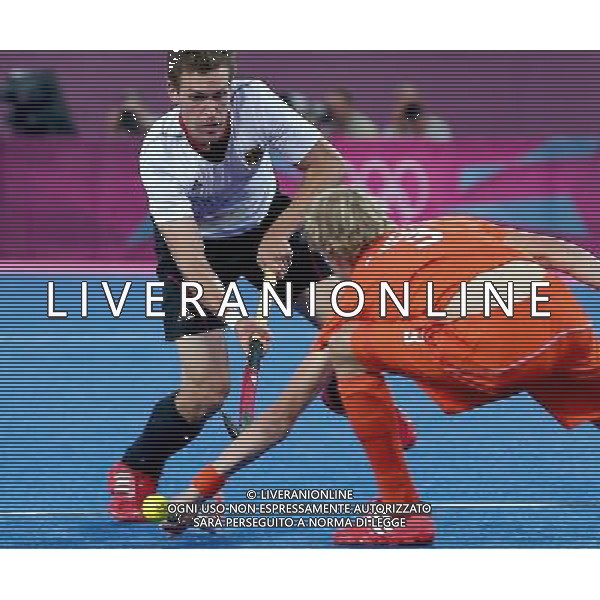 (120811) -- LONDON, Aug. 11, 2012 () -- Tim Jenniskens of the Netherlands (front) vies for the ball during the gold medal match of men\'s Hockey between the Netherlands and Germany at London 2012 Olympic Games, London, Britain, Aug. 11, 2012. (/Chen Jianli) ©PHOTOSHOT/Agenzia Aldo Liverani Sas - ITALY ONLY - GIOCHI OLIMPICI, OLIMPIADI LONDRA 2012