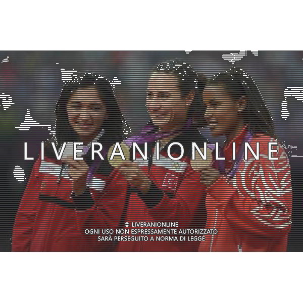 (120810) -- LONDON, Aug. 10, 2012 () -- Gold medalist Asli Cakir Alptekin (C) of Turkey, silver medalist Gamze Bulut (L) of Turkey, bronze medalist Maryam Yusuf Jamal of Bahrain pose at awarding ceremony of women\'s 1500m at London 2012 Olympic Games, London, Britain, Aug. 11, 2012. (/Wang Jianhua)(zgp) ©PHOTOSHOT/Agenzia Aldo Liverani Sas - ITALY ONLY - GIOCHI OLIMPICI, OLIMPIADI LONDRA 2012