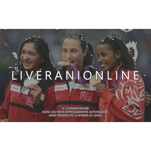 (120810) -- LONDON, Aug. 10, 2012 () -- Gold medalist Asli Cakir Alptekin (C) of Turkey, silver medalist Gamze Bulut (L) of Turkey, bronze medalist Maryam Yusuf Jamal of Bahrain pose at awarding ceremony of women\'s 1500m at London 2012 Olympic Games, London, Britain, Aug. 11, 2012. (/Wang Jianhua)(zgp) ©PHOTOSHOT/Agenzia Aldo Liverani Sas - ITALY ONLY - GIOCHI OLIMPICI, OLIMPIADI LONDRA 2012