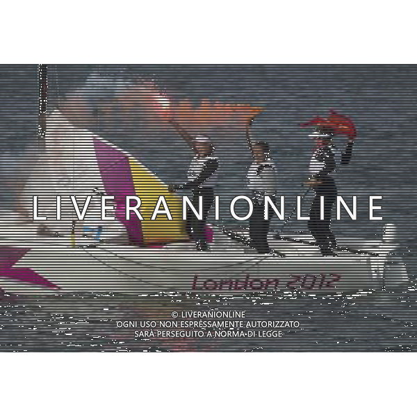 11.08.2012. Weymouth, Dorset, England. Members of The Spanish team Celebrate After winning the Elliott 6m Competition of sailing Event London 2012 Olympic Games The Spanish team Won Gold Medal ©PHOTOSHOT/Agenzia Aldo Liverani Sas - ITALY ONLY - GIOCHI OLIMPICI, OLIMPIADI LONDRA 2012