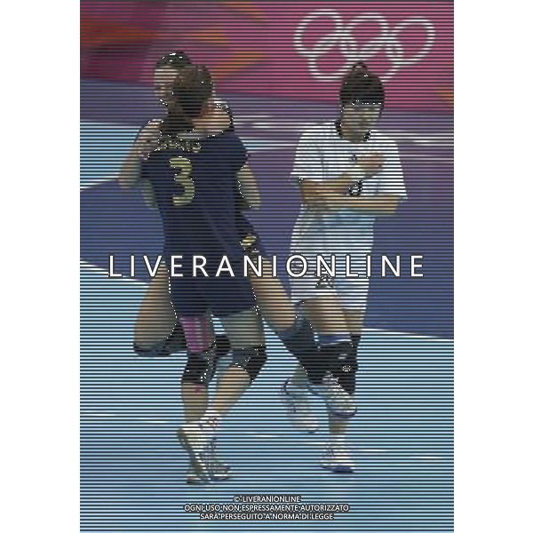 (120811) -- LONDON, Aug. 11, 2012 () -- Players of Spain celebrate while Jung Jihae of South Korea passes by after the bronze medal match of women\'s Handball between South Korea and Spain at London 2012 Olympic Games, London, Britain, Aug. 11, 2012. Spain won the match and claimed the bronze medal of the event. (/Shen Bohan) ©PHOTOSHOT/Agenzia Aldo Liverani Sas - ITALY ONLY - GIOCHI OLIMPICI, OLIMPIADI LONDRA 2012