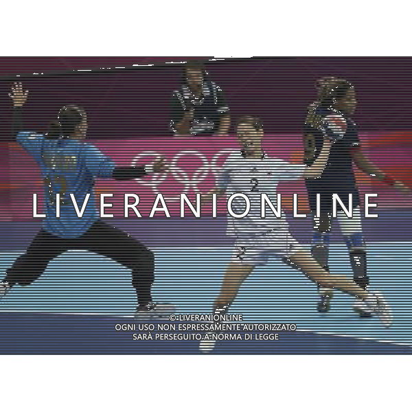 (120811) -- LONDON, Aug. 11, 2012 () -- Wo Sun Hee (C) of South Korea attacks during the bronze medal match of women\'s Handball between South Korea and Spain at London 2012 Olympic Games, London, Britain, Aug. 11, 2012. Spain won the match and claimed the bronze medal of the event. (/Shen Bohan) ©PHOTOSHOT/Agenzia Aldo Liverani Sas - ITALY ONLY - GIOCHI OLIMPICI, OLIMPIADI LONDRA 2012