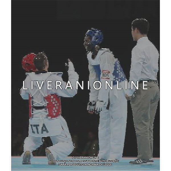 (120811) -- LONDON, Aug. 11, 2012 () -- Carlo Molfetta of Italy (red) celebrates after winning over Anthony Obame of Gabon during Bahri Tanrikulu of Turkey during the gold medal match of men\'s +80kg Taekwondo at London 2012 Olympic Games, London, Britain, Aug. 11, 2012. Carlo Molfetta of Italy won the match and claimed the gold medal of the event. (/Wang Lili) ©PHOTOSHOT/Agenzia Aldo Liverani Sas - ITALY ONLY - GIOCHI OLIMPICI, OLIMPIADI LONDRA 2012