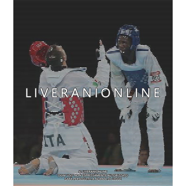 (120811) -- LONDON, Aug. 11, 2012 () -- Carlo Molfetta of Italy (red) celebrates after winning over Anthony Obame of Gabon during Bahri Tanrikulu of Turkey during the gold medal match of men\'s +80kg Taekwondo at London 2012 Olympic Games, London, Britain, Aug. 11, 2012. Carlo Molfetta of Italy won the match and claimed the gold medal of the event. (/Wang Lili) ©PHOTOSHOT/Agenzia Aldo Liverani Sas - ITALY ONLY - GIOCHI OLIMPICI, OLIMPIADI LONDRA 2012