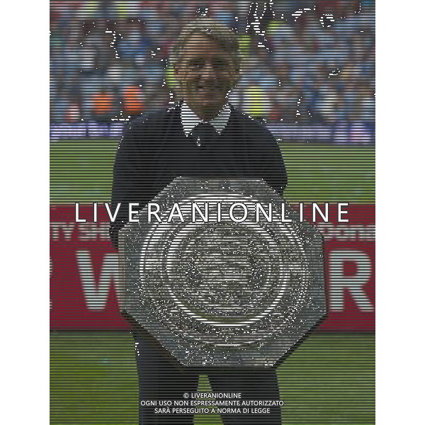 Manchester City\'s Manager Roberto Mancini poses with the trophy Football Friendly - FA Community Shield - Chelsea v Manchester City - Sunday 12th August 2012 - Villa Park - Birmingham å© CameraSport - 43 Linden Ave. Countesthorpe. Leicester. England. LE8 5PG - Tel: +44 (0) 116 277 4147 - admin@camerasport.com - www.camerasport.com AG ALDO LIVERANI S A S ONLY ITALY