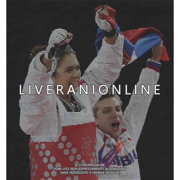 (120811) -- LONDON, Aug. 11, 2012 () -- Milica Mandic of Serbia (red) celebrates after winning over Anne-Caroline Graffe of France during the gold medal match of women\'s +67kg Taekwondo at London 2012 Olympic Games, London, Britain, Aug. 11, 2012. Milica Mandic of Serbia won the match and claimed the gold medal of the event. (/Wang Lili) ©PHOTOSHOT/Agenzia Aldo Liverani Sas - ITALY ONLY - GIOCHI OLIMPICI, OLIMPIADI LONDRA 2012