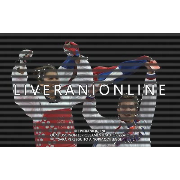 (120811) -- LONDON, Aug. 11, 2012 () -- Milica Mandic of Serbia (red) celebrates after winning over Anne-Caroline Graffe of France during the gold medal match of women\'s +67kg Taekwondo at London 2012 Olympic Games, London, Britain, Aug. 11, 2012. Milica Mandic of Serbia won the match and claimed the gold medal of the event. (/Wang Lili) ©PHOTOSHOT/Agenzia Aldo Liverani Sas - ITALY ONLY - GIOCHI OLIMPICI, OLIMPIADI LONDRA 2012