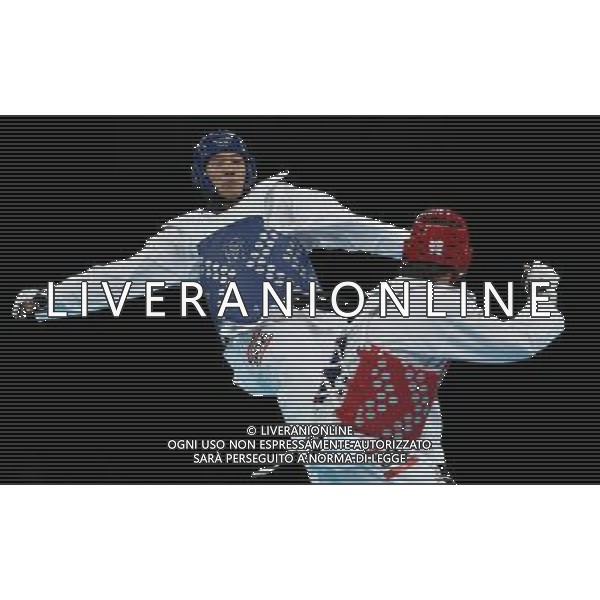 (120811) -- LONDON, Aug. 11, 2012 () -- Liu Xiaobo of China (blue) celebrates after winning over Bahri Tanrikulu of Turkey during the bronze medal match of men\'s +80kg Taekwondo at London 2012 Olympic Games, London, Britain, Aug. 11, 2012. Liu Xiaobo of China won the match and claimed the bronze medal of the event. (/Wang Lili) ©PHOTOSHOT/Agenzia Aldo Liverani Sas - ITALY ONLY - GIOCHI OLIMPICI, OLIMPIADI LONDRA 2012