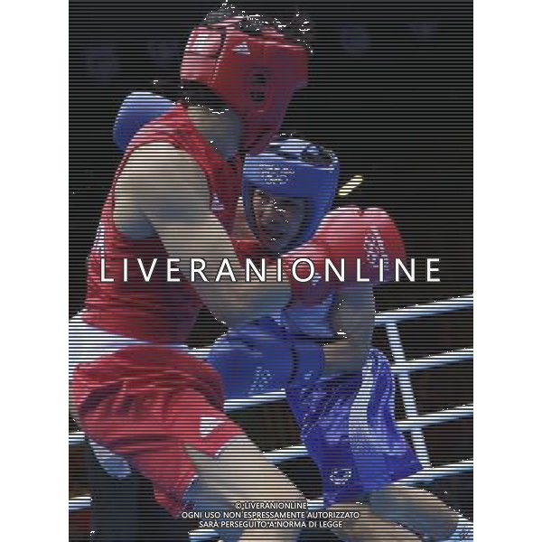 (120811) -- LONDON, Aug. 11, 2012 () -- Zhou Shiming of China (in red) competes with Kaeo Pongprayoon of Thailand during men\'s boxing light fly (49kg) gold medal match, at London 2012 Olympic Games in London, Britain, on August 11, 2012. Zhou Shiming of China defeated Kaeo Pongprayoon of Thailand. (/Wang Shen) (nxl) ©PHOTOSHOT/Agenzia Aldo Liverani Sas - ITALY ONLY - GIOCHI OLIMPICI, OLIMPIADI LONDRA 2012