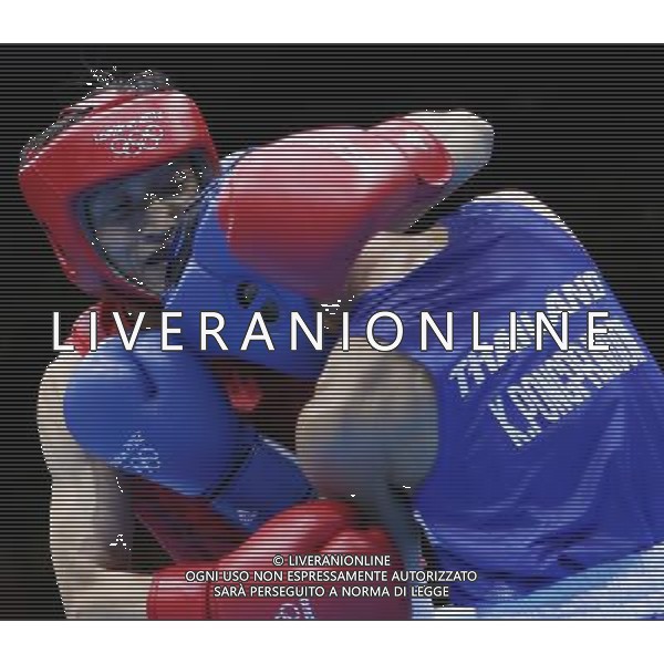 (120811) -- LONDON, Aug. 11, 2012 () -- Zhou Shiming of China (in red) competes with Kaeo Pongprayoon of Thailand during men\'s boxing light fly (49kg) gold medal match, at London 2012 Olympic Games in London, Britain, on August 11, 2012. Zhou Shiming of China defeated Kaeo Pongprayoon of Thailand. (/Wang Shen) (nxl) ©PHOTOSHOT/Agenzia Aldo Liverani Sas - ITALY ONLY - GIOCHI OLIMPICI, OLIMPIADI LONDRA 2012
