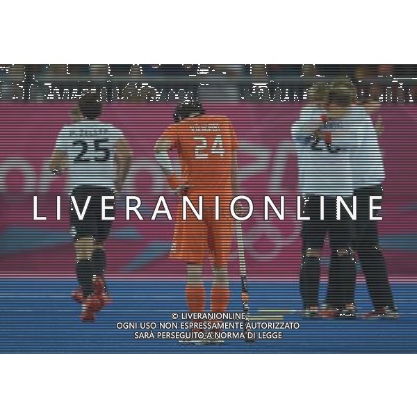 (120811) -- LONDON, Aug. 11, 2012 () -- Robert van der Horst (front) looks depressed while players of Germany celebrate victory after the gold medal match of men\'s Hockey between the Netherlands and Germany at London 2012 Olympic Games, London, Britain, Aug. 11, 2012. Germany won the match 2-1 and claimed the gold medal. (/Wang Yuguo) ©PHOTOSHOT/Agenzia Aldo Liverani Sas - ITALY ONLY - GIOCHI OLIMPICI, OLIMPIADI LONDRA 2012