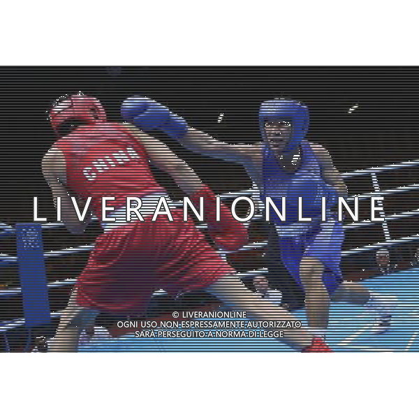 (120811) -- LONDON, Aug. 11, 2012 () -- Zhou Shiming of China (in red) competes with Kaeo Pongprayoon of Thailand during men\'s boxing light fly (49kg) gold medal match, at London 2012 Olympic Games in London, Britain, on August 11, 2012. Zhou Shiming of China defeated Kaeo Pongprayoon of Thailand. (/Wang Shen) (nxl) ©PHOTOSHOT/Agenzia Aldo Liverani Sas - ITALY ONLY - GIOCHI OLIMPICI, OLIMPIADI LONDRA 2012