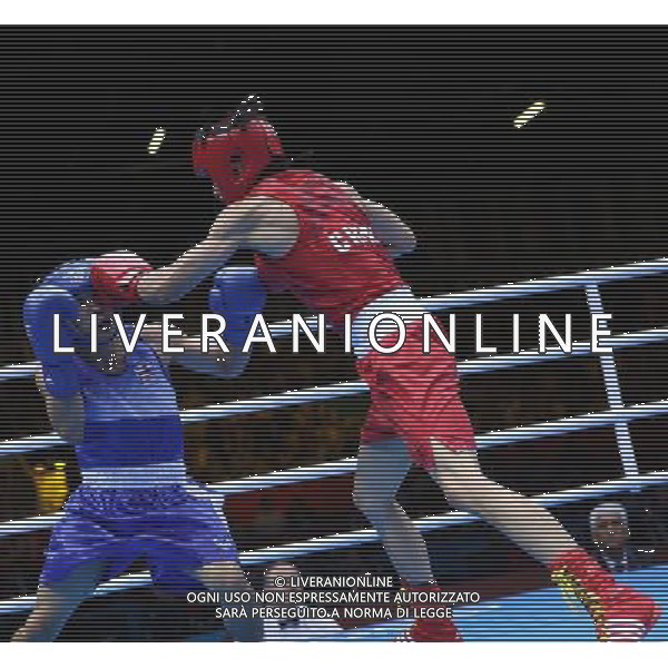 (120811) -- LONDON, Aug. 11, 2012 () -- Zhou Shiming of China (in red) competes with Kaeo Pongprayoon of Thailand during men\'s boxing light fly (49kg) gold medal match, at London 2012 Olympic Games in London, Britain, on August 11, 2012. Zhou Shiming of China defeated Kaeo Pongprayoon of Thailand. (/Wang Shen) ©PHOTOSHOT/Agenzia Aldo Liverani Sas - ITALY ONLY - GIOCHI OLIMPICI, OLIMPIADI LONDRA 2012