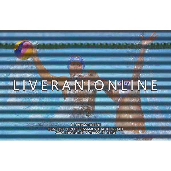 (120812) -- LONDON, Aug. 12, 2012 () -- A player of Italy is challenged during men\'s water polo gold medal match between Croatia and Italy at London 2012 Olympic Games in London, Britain, August 12, 2012. Croatia won the match and claimed the gold medal of the event. Italy won the silver medal of the event. (/Chen Xiaowei) ITALY ONLY - GIOCHI OLIMPICI, OLIMPIADI LONDRA 2012