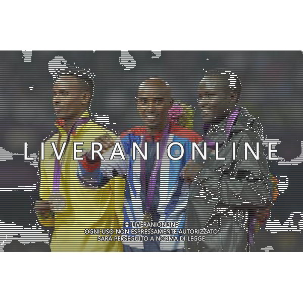 Mo Farrah (GB) with his Gold medal after winning the men\'s 5000m and Dejen Gebremeskel (Ethiopia) Silver medalist (L) and Thomas Pkemei Longosiwa (Kenya) bronze medalist (R). Olympic Stadium, Olympic Park, Stratford. London ©PHOTOSHOT/AGENZIA ALDO LIVERANI SAS - ITALY ONLY - GIOCHI OLIMPICI, OLIMPIADI LONDRA 2012
