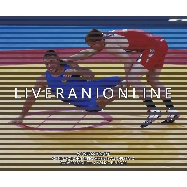 (120812) -- LONDON, Aug. 12, 2012 () -- Jacob Stephen Varner of USA (in red) competes with Valerii Andriitsev of Ukraine during men\'s wrestling freestyle 96kg gold medal contest, at London 2012 Olympic Games in London, Britain, on August 12, 2012. Jacob Stephen Varner of USA won gold medal. (/Ren Zhenglai) (nxl) ©PHOTOSHOT/AGENZIA ALDO LIVERANI SAS - ITALY ONLY - GIOCHI OLIMPICI, OLIMPIADI LONDRA 2012