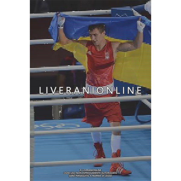 (120812) -- LONDON, Aug. 12, 2012 () -- Vasyl Lomachenko of Ukraine celebrates after defeating Han Soonchul of South Korea in men\'s boxing light (60kg) gold medal contest, at London 2012 Olympic Games in London, Britain, on August 12, 2012. Vasyl Lomachenko of Ukraine won gold medal. (/Guo Yong) (nxl) ©PHOTOSHOT/AGENZIA ALDO LIVERANI SAS - ITALY ONLY - GIOCHI OLIMPICI, OLIMPIADI LONDRA 2012