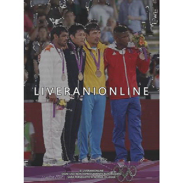 (120812) -- LONDON, Aug. 12, 2012 () -- Gold medalist Tatsuhiro Yonemitsu of Japan (2nd L), silver medalist Sushil Kumar of India (1st L) and bronze medalists Akzhurek Tanatarov of Kazakhstan (2nd R) and Livan Lopez Azcuy of Cuba attend victory ceremony of men\'s boxing freestyle 66kg competition, at London 2012 Olympic Games in London, Britain, on August 12, 2012. (/Shen Bohan) (nxl) ©PHOTOSHOT/AGENZIA ALDO LIVERANI SAS - ITALY ONLY - GIOCHI OLIMPICI, OLIMPIADI LONDRA 2012