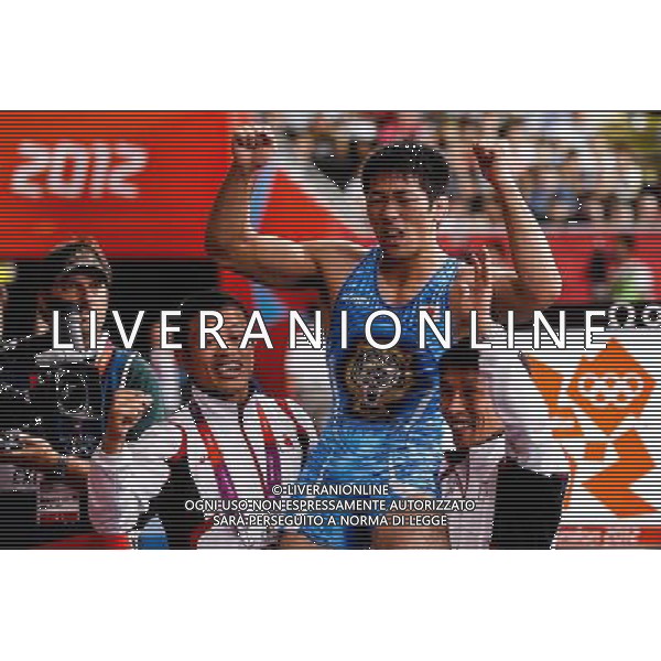 (120812) -- LONDON, Aug. 12, 2012 () -- Tatsuhiro Yonemitsu of Japan (in blue) celebrates after defeating Sushil Kumar of India in men\'s wrestling freestyle 66kg gold medal match, at London 2012 Olympic Games in London, Britain, on August 12, 2012. (/Jin Liwang) (nxl) ©PHOTOSHOT/AGENZIA ALDO LIVERANI SAS - ITALY ONLY - GIOCHI OLIMPICI, OLIMPIADI LONDRA 2012