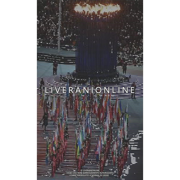 (120812) -- LONDON, Aug. 12, 2012 () -- Flag-bearers hold flags of Olympic delegations at the Closing Ceremony of the London 2012 Olympic Games at the Olympic Stadium in London, Britain, August 12, 2012. (/Wang Qingqin) (zgp) ©PHOTOSHOT/AGENZIA ALDO LIVERANI SAS - ITALY ONLY - CERIMONIA DI CHIUSURA DEI GIOCHI OLIMPICI, OLIMPIADI LONDRA 2012