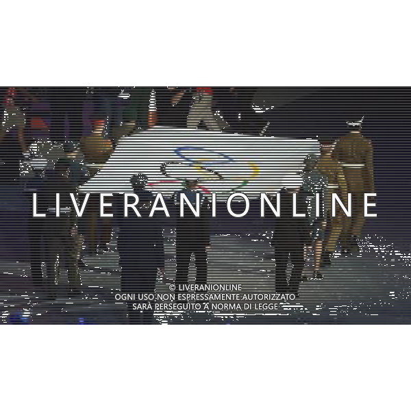 (120812) -- LONDON, Aug. 12, 2012 () -- The Olympic Flag is escorted into the Olympic Stadium at the Closing Ceremony of the London 2012 Olympic Games in London, Britain, August 12, 2012. (/Wang Qingqin) (zgp) ©PHOTOSHOT/AGENZIA ALDO LIVERANI SAS - ITALY ONLY - CERIMONIA DI CHIUSURA DEI GIOCHI OLIMPICI, OLIMPIADI LONDRA 2012