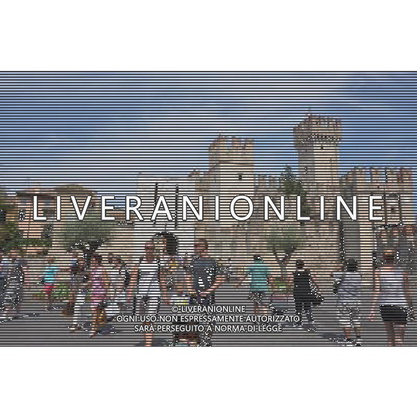 (120815) -- SIRMIONE, Aug. 15, 2012 () -- The Scaliger Castle is seen in the photo taken in Sirmione, Italy, on Aug. 12, 2012. The Scaliger Castle is located in the Italian lakeside town of Sirmione. Sirmione has a beautiful historic center which is situated on top of a small peninsula that just out into the southern portion of Lake Garda. Built in the 13th century by the Scaliger family, the Scaliger Castle is considered one of the finest examples of a medieval fortification, including a very rare fortified port. (/Song Jian) ©photoshot/Agenzia Aldo Liverani Sas - ITALY ONLY - Il Castello Scaligero di Sirmione con un bellissimo centro storico che si trova sulla cima di una piccola penisola del Lago di Garda - SIRMIONE, Italia 15 agosto 2012